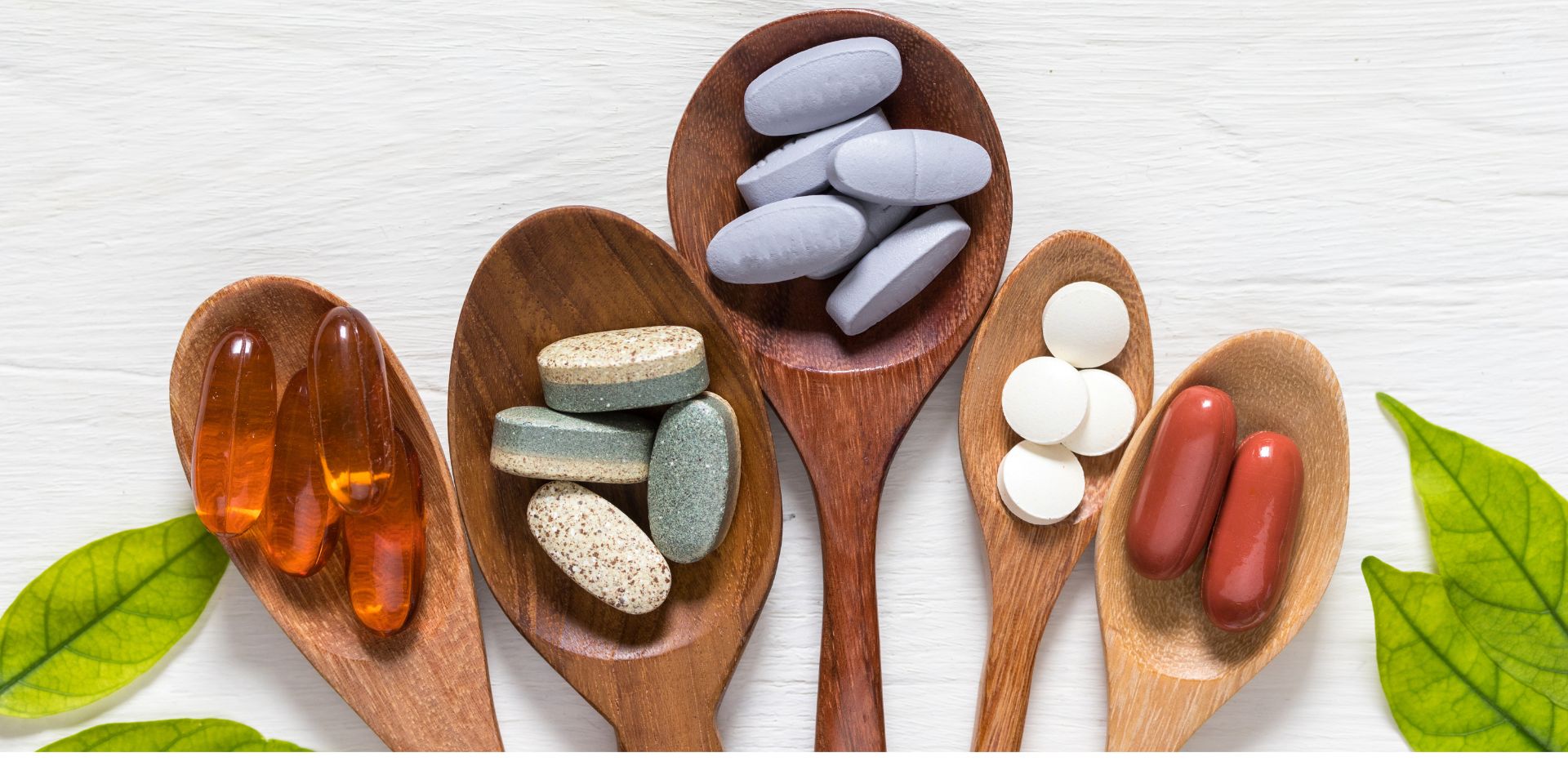 wood spoons with nutritional supplements for spine health